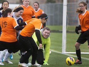 Meadow Lake Carpenter H.S. Spartans goaltender #1 Alexa Hunter chases a rolling ball on her knees keeping the Evan Hardy Souls from going up 3-1 during first half play at the 2A High School Provincial Soccer Championships at at the SaskTel Soccer Fields, October 28, 2016.