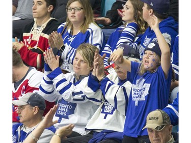 Fans don the jersey of their favourite team as the NHL's Toronto Maple Leafs and Ottawa Senators play an exhibition game at SaskTel Centre in Saskatoon, October 4, 2016.