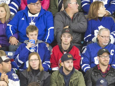 Fans don the jersey of their favourite team as the NHL's Toronto Maple Leafs and Ottawa Senators play an exhibition game at SaskTel Centre in Saskatoon, October 4, 2016.
