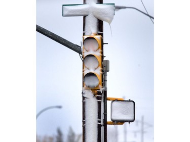 Dangerous driving condition were found around Saskatoon, especially with traffic lights facing north into the sticky blowing snow, October 5, 2016.