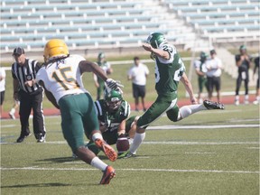 (#23) Sean Stenger attempts a field goal during an exhibition scrimmage against the Golden Bears at Griffiths Stadium during an in Saskatoon on Saturday, August 20th, 2016.