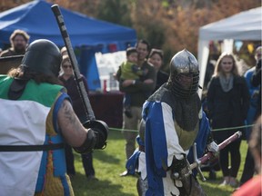Members of Myrgan Wood perform battle scenes in front of a crowd during the Prairie Paladin Medieval Market and Faire located at the University of Saskatchewan in Saskatoon, October 1, 2016.
