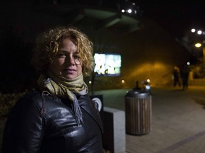 Christine Kirouac stands in front of her video projection titled " Don't go away" during this year's Nuit Blanche.