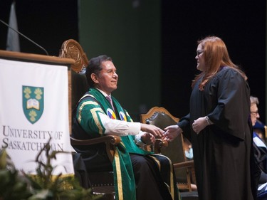 Blaine Favel shakes hands with newly graduated U of S students during Fall Convocation at TCU Place in Saskatoon, October 22, 2016.