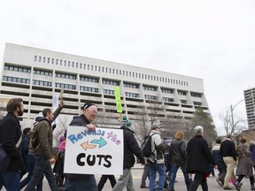 A crowd marches downtown in light of the recent cuts to the Lighthouse facility in Saskatoon, Saskatchewan on Saturday, October 22nd, 2016.