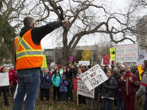 Dozens of people marched through downtown Saskatoon in October to protest provincial government cuts to the Lighthouse.
