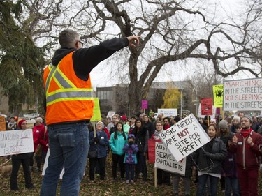 Peter Garden, from the STAND community organization, discusses the recent cuts to the Lighthouse services in front of a crowd at Friendship Park in Saskatoon, October 22, 2016.