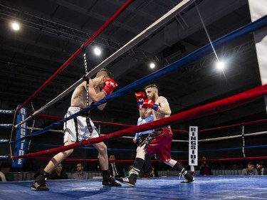 Jessie McMillian (L) squares off against Kye Sabo during the 135-pound match at Prairieland Park in Saskatoon, October 22, 2016.