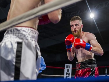 Kye Sabo (R) squares off against Jessie McMillian during the 135-pound match at Prairieland Park in Saskatoon, October 22, 2016.