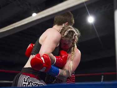 Michelle Nelson (R) squares off against at Stephanie Essensa during the 125-pound match at Prairieland Park in Saskatoon, October 22, 2016.