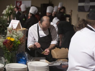 A member of the Saskatoon Club Culinary team prepares the competing dish at this year's Gold Medal Plates Competition at TCU Place in Saskatoon, October 29, 2016.