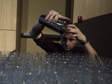 Morgan Billard prepares old fashions for guests at the Gold Medal Plates Competition at TCU Place in Saskatoon, October 29, 2016.