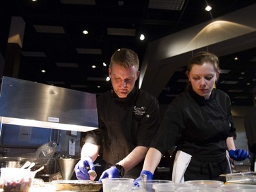 Sean McConnell (L), the Sous Chef at Riverside, prepares for the Gold Medal Plates Competition at TCU Place in Saskatoon, October 29, 2016.