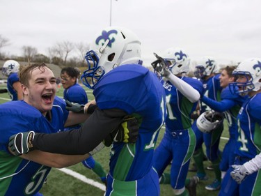 Bishop J. Mahoney Saints #5 David Lett celebrates with his team after defeating the Marion Graham Falcons during the Saskatoon 3A high school football finals at SMF Field in Saskatoon, October 29, 2016.