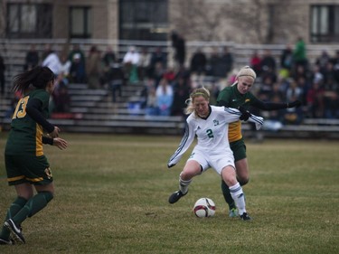 U of S Huskies #2 Rebecca Weckworth moves the ball past a Regina Cougars player during the game at the University of Saskatchewan in Saskatoon, October 29, 2016.