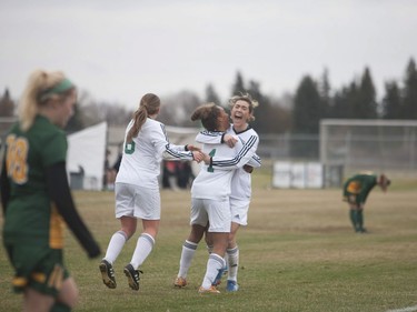 U of S Huskies #3 Ella Molnar celebrates a goal with teammates #1 Jadyn Steinhauer and #6 Jackson Wiegers  during the game at the University of Saskatchewan in Saskatoon, October 29, 2016.