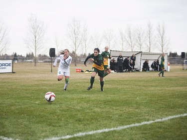 U of S Huskies #6 Jackson Wiegers chases after the ball beside Regina Cougars #13 Shayla Kapila during the game at the University of Saskatchewan in Saskatoon, October 29, 2016.