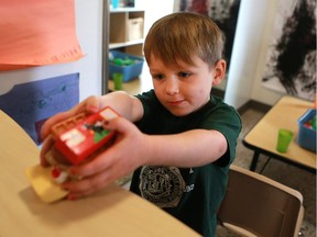 Jackson Fisher serves up a sandwich in his food truck in the Firefly room during the official opening of the newest USSU childcare centre at the McEown Location in Saskatoon on October 17, 2016. (Michelle Berg / The StarPhoenix)