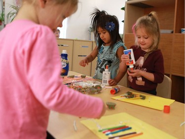 L-R: Jesmond Thompson, Mylie Roy-Pritchard and Giorgi Courteau make crafts in the Firefly room during the official opening of the newest USSU childcare centre at the McEown location in Saskatoon on October 17, 2016.