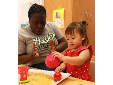 Raelynn Xiao experiments with macaroni in the Bumblebees room during the official opening of the newest USSU childcare centre at the McEown location in Saskatoon on October 17, 2016.
