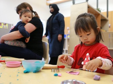 Raven Liu experiments with play doh in the Butterfly room during the official opening of the newest USSU childcare centre at the McEown location in Saskatoon on October 17, 2016.