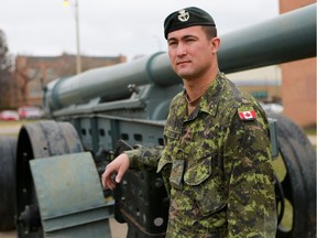 Sgt. Ross McIvor poses for a photo in front of the Sgt Hugh Cairns VC Armoury in Saskatoon.