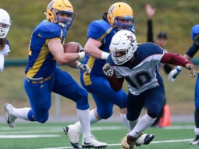 Saskatoon Hilltops' Logan Fischer runs with the ball during the PFC junior football semifinal against Regina Thunder at SMF Field in Gordie Howe Park on Sunday.