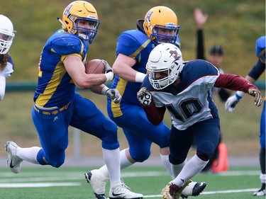 Saskatoon Hilltops' Logan Fischer runs with the ball during the PFC junior football semifinal against Regina Thunder at SMF Field in Gordie Howe Park in Saskatoon on October 23, 2016.