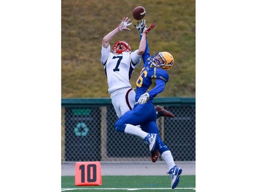 Calgary Colts' Dylan Schrot and Saskatoon Hilltops' Luke Melnyk try to make the catch during the Prairie Football Conference championship game at SMF field in Saskatoon on October 30, 2016.