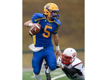 Saskatoon Hilltops' Jared Andreychuck dodges a tackle during the Prairie Football Conference championship game against the Calgary Colts at SMF field in Saskatoon on October 30, 2016.