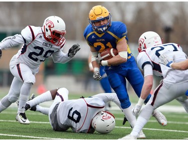 Saskatoon Hilltops' Logan Fischer runs with the ball during the Prairie Football Conference championship game against the Calgary Colts at SMF field in Saskatoon on October 30, 2016.