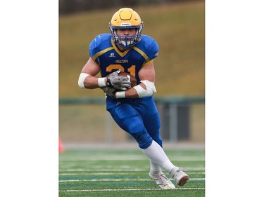 Saskatoon Hilltops' Logan Fischer runs with the ball during the Prairie Football Conference championship game against the Calgary Colts at SMF field in Saskatoon on October 30, 2016.