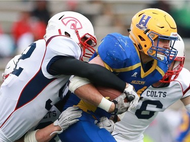 Saskatoon Hilltops' Logan Fischer runs with the ball during the Prairie Football Conference championship game against the Calgary Colts at SMF field in Saskatoon on October 30, 2016.