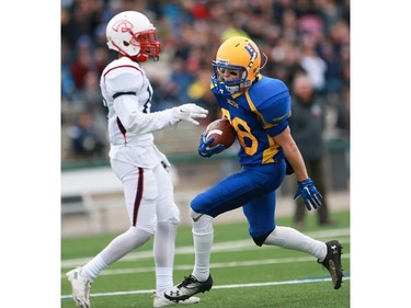 Saskatoon Hilltops' Ryan Turple scores a touchdown during the Prairie Football Conference championship game against the Calgary Colts at SMF field in Saskatoon on October 30, 2016.
