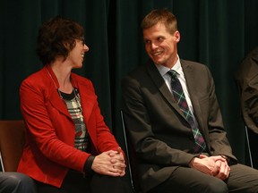 SASKATOON, SK - October 5, 2016 - Mayoral candidate Kelley Moore speaks with fellow candidate Charlie Clark at a mayoral forum at Luther Heights in Saskatoon on October 5, 2016. (Michelle Berg / The StarPhoenix)
