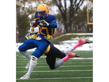 Saskatoon Hilltops' Des Vessey is tackled during their game against the Edmonton Wildcats at SMF Field at Gordie Howe Bowl in Saskatoon on October 9, 2016.