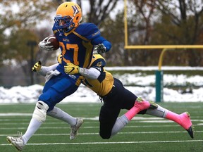 Saskatoon Hilltops' Des Vessey is tackled during their game against the Edmonton Wildcats game at SMF Field at Gordie Howe Bowl in Saskatoon on October 9, 2016.