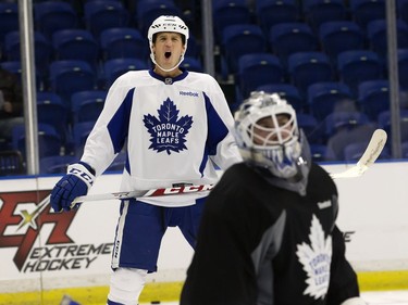 Brooks Laich of the Toronto Maple Leafs (L) reacts during a pre-game skate at SaskTel Centre before facing the Ottawa Senators, October 4, 2016.