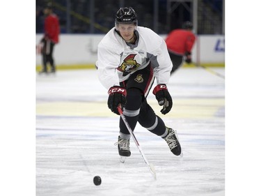 Thomas Chabot of the NHL Ottawa Senators chases the puck during a pre-game skate at SaskTel Centre before an evening game against the Toronto Maple Leafs, October 4, 2016.