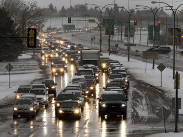 A heavy, wet snow from a major weather system left Saskatoon residents shovelling and driving in slippery conditions, October 5, 2016.  Intermittent power outages affected traffic lights and created backlogs, as here on College Drive at Campus Drive.