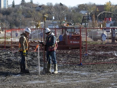 Staff from Webb Surveys place stakes as work begins on Parcel Y in downtown Saskatoon, October 12, 2016.