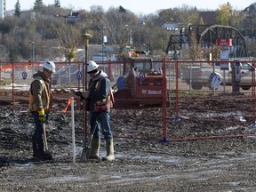 Staff from Webb Surveys place stakes as work begins on Parcel Y in the downtown, Wednesday, October 12, 2016.