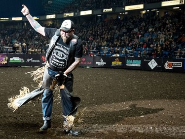 A fan attempts to ride a "bull"during the Professional bullriding Canadian final at SaskTel Centre in Saskatoon, October 15, 2016.