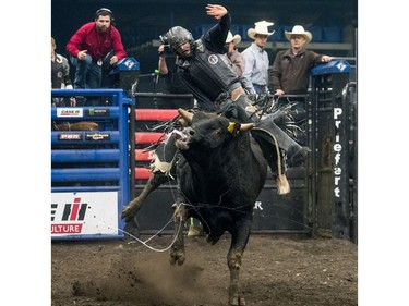 Garrett Green rides a bull during the Professional bullriding Canadian final at SaskTel Centre in Saskatoon, October 15, 2016.