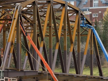 Work continues on a new span of the traffic bridge and on building a stone jetty to the remaining old span, October 18, 2016.