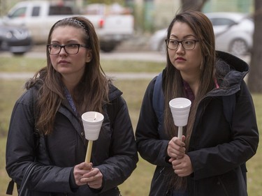 People attend a candlelight vigil outside the Gordon Oakes Red Bear Student Centre on the University of Saskatchewan campus to support those affected by the tragedies of youth suicides in northern Saskatchewan, October 20, 2016.