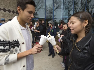 People attend a candlelight vigil outside the Gordon Oakes Red Bear Student Centre on the University of Saskatchewan campus to support those affected by the tragedies of youth suicides in northern Saskatchewan, October 20, 2016.