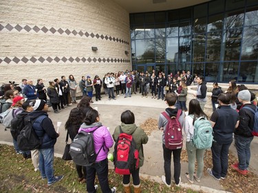 People attend a candlelight vigil outside the Gordon Oakes Red Bear Student Centre on the University of Saskatchewan campus to support those affected by the tragedies of youth suicides in northern Saskatchewan, October 20, 2016.