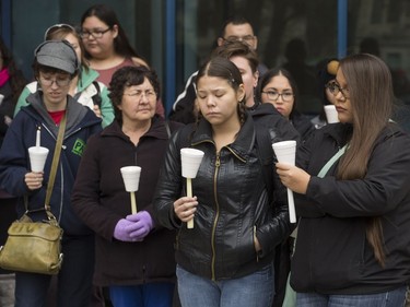 People attend a candlelight vigil outside the Gordon Oakes Red Bear Student Centre on the University of Saskatchewan campus to support those affected by the tragedies of youth suicides in northern Saskatchewan, October 20, 2016.