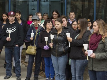 People attend a candlelight vigil outside the Gordon Oakes Red Bear Student Centre on the University of Saskatchewan campus to support those affected by the tragedies of youth suicides in northern Saskatchewan, October 20, 2016.